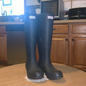 Black tall hunter boots